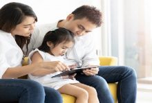 Asian family happy on the bedroom in the house with sunlight fro