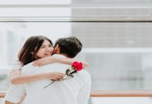 Happy,Beautiful,Young,Asian,Woman,Embracing,Her,Boyfriend,After,Receive