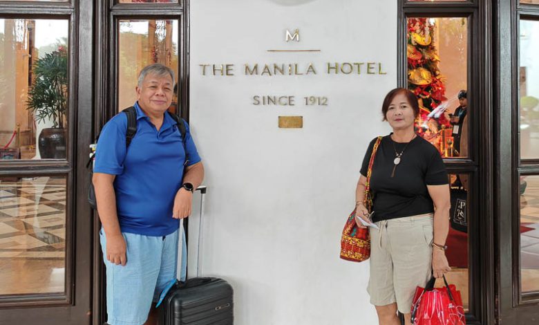 me and my wife at the entrance of manila hotel